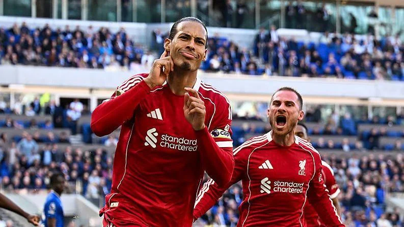 Virgil van Dijk celebrates scoring against Everton
