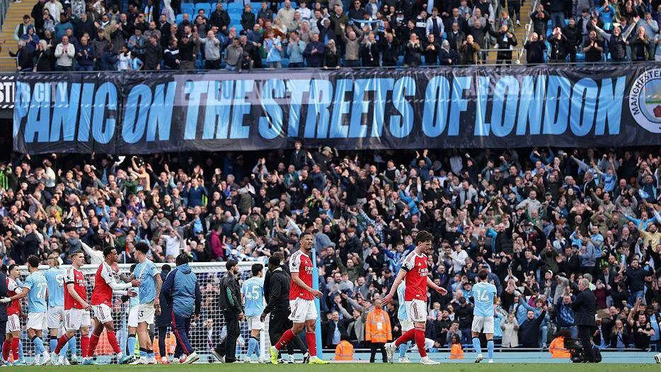 Manchester City fans display a banner mocking Arsenal after the 2-1 win.