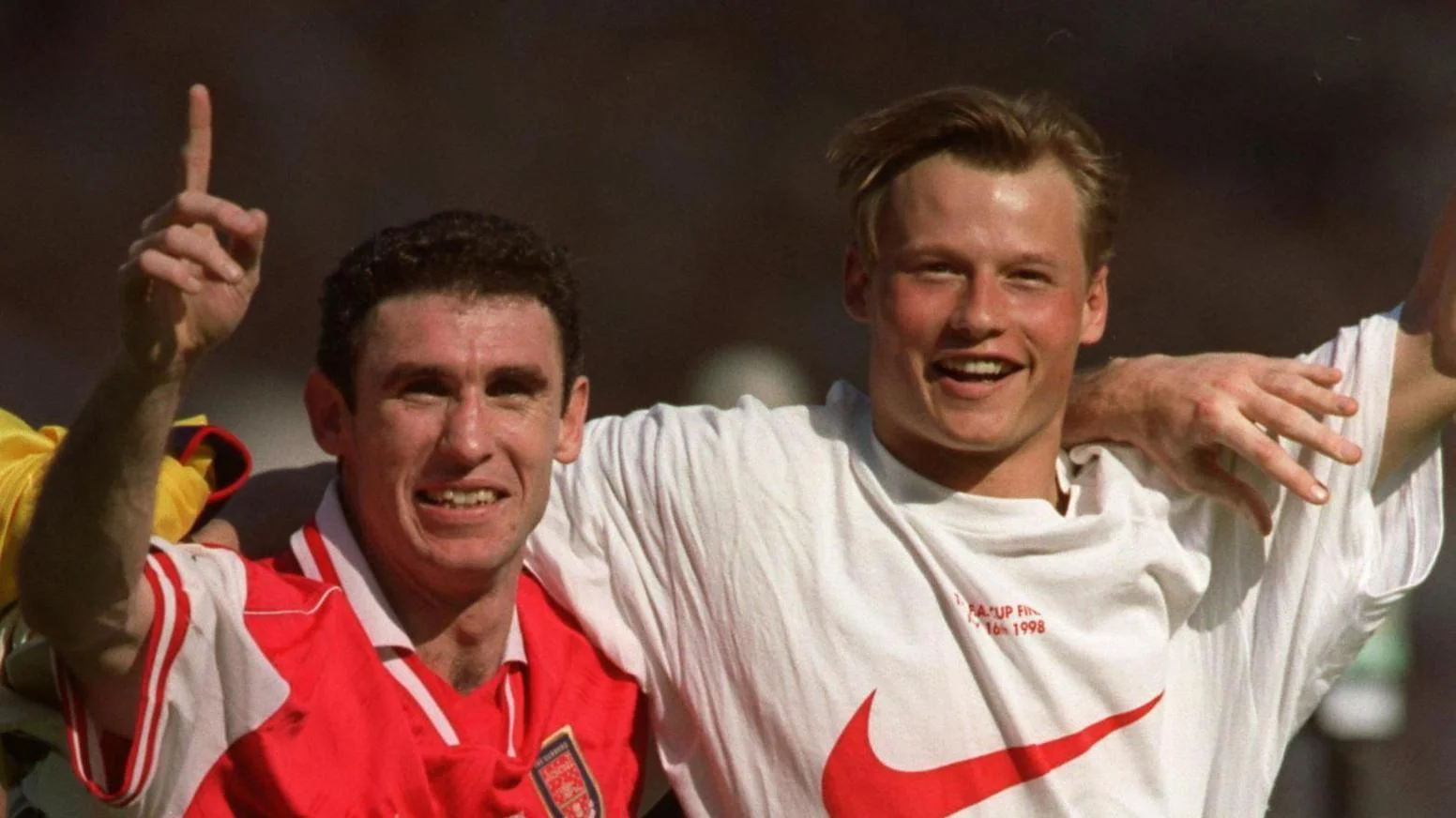 Martin Keown and Alex Manninger celebrate together at Wembley after Arsenal's FA Cup final win over Newcastle in 1998