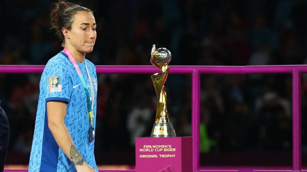 Lucy Bronze looks at the World Cup trophy after the final